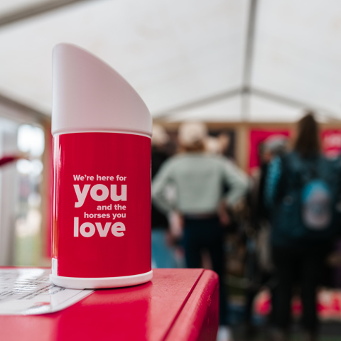 BHS donation tin on a desk at an event